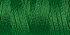 Spool of emerald green coloured rayon embroidery thread. Code 1051.