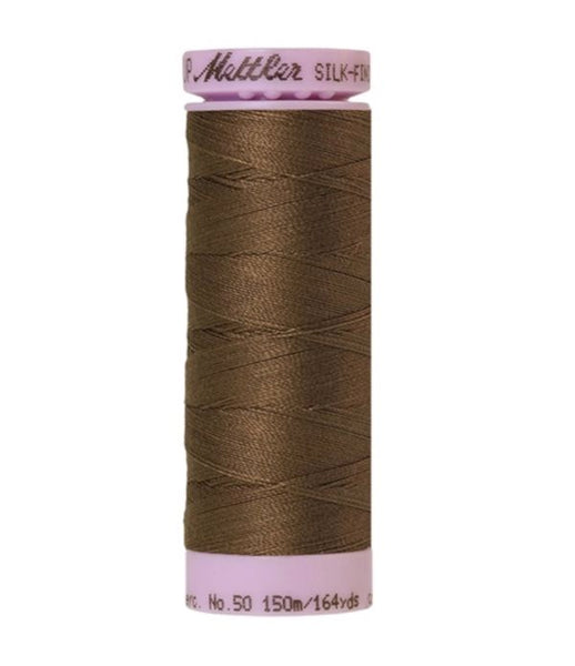 Spool of dark brown coloured cotton thread - Pine Park code 1182