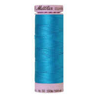 Spool of Mettler cotton thread in Caribbean Blue - code 1394