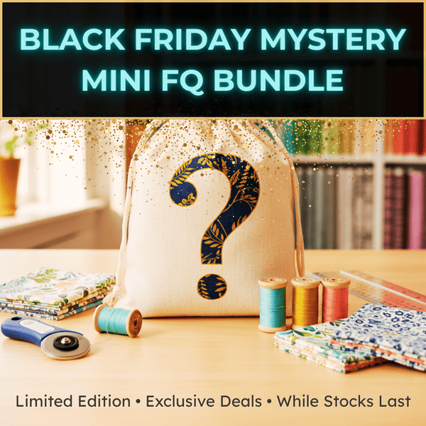 A fabric bundle in a drawstring bag with a large question mark, surrounded by fabric pieces, thread spools, and a rotary cutter. Text reads: “Black Friday Mystery Mini FQ Bundle. Limited Edition • Exclusive Deals • While Stocks Last.”.