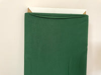 A bolt of quilting fabric in christmas green