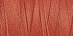 Close-up of dusky rose pink cotton thread