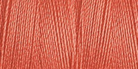 Close-up of a coral-colored yarn swatch