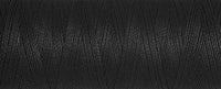 A close up view of black bobbin thread for embroidery.