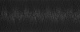A close up view of black bobbin thread for embroidery.
