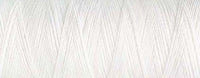 A close up view of white bobbin thread for embroidery.