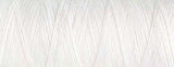 A close up view of white bobbin thread for embroidery.