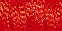 Spool of red coloured rayon embroidery thread. Code 1037.