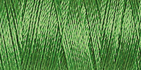 Spool of spring green coloured rayon embroidery thread. Code 1049.
