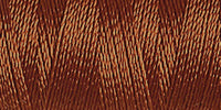 Spool of medium brown rayon embroidery thread. Code 1057.