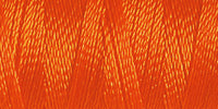 Spool of orange rayon embroidery thread. Code 1078.