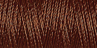 Spool of coffee brown rayon embroidery thread. Code 1129.