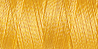 Spool of rayon embroidery thread in a mustard yellow. Code 1167.