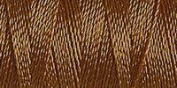 Spool of muddy brown rayon embroidery thread. Code 1170.