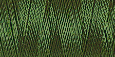 Spool of dark green coloured rayon embroidery thread. Code 1175.