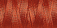 Spool of dusky rose coloured rayon embroidery thread. Code 1216.