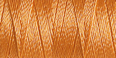 Spool of peach rayon embroidery thread. Code 1239.