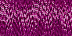 Spool of mauve coloured rayon embroidery thread. Code 1255.