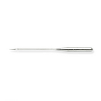 A sewing machine needle laying on its side