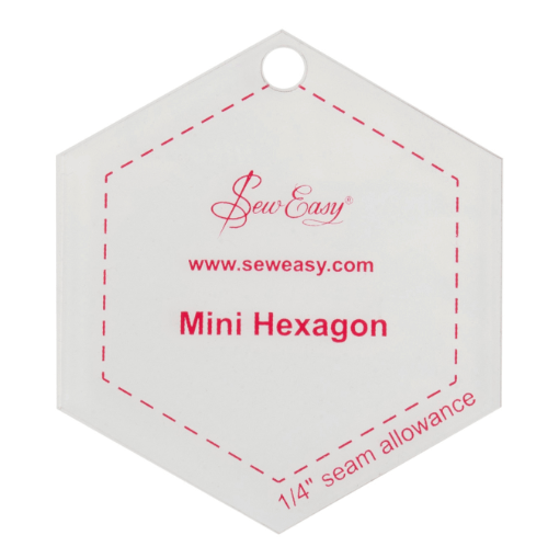 A clear acrylic hexagon template with a quarter inch seam allowance marked in red