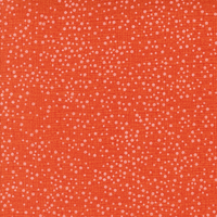 Orange fabric with small white dots