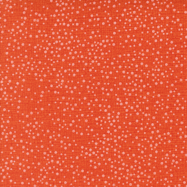 Orange fabric with small white dots