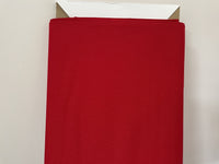 A bolt of quilting fabric in christmas red