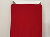 A bolt of quilting fabric in christmas red