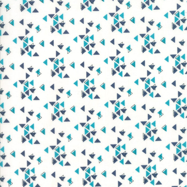 White cotton fabric with small blue triangles