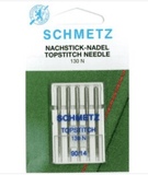 A pack of five top stitch Schmetz sewing machine needles in a green packet in size 90-14
