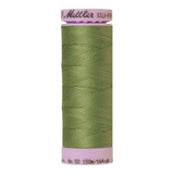 A 150m spool of Mettler silk coated cotton thread in soft green (code 0840), ideal for piecing.