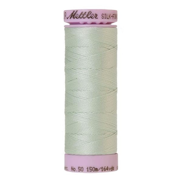 Spool of pale green cotton thread in Luster code 0018