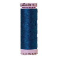 Spool of dark blue coloured cotton thread - Colonial Blue code 0024