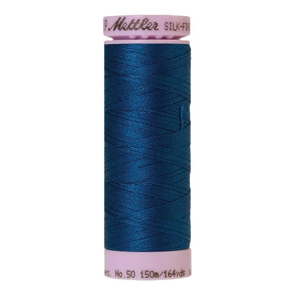 Spool of dark blue coloured cotton thread - Colonial Blue code 0024