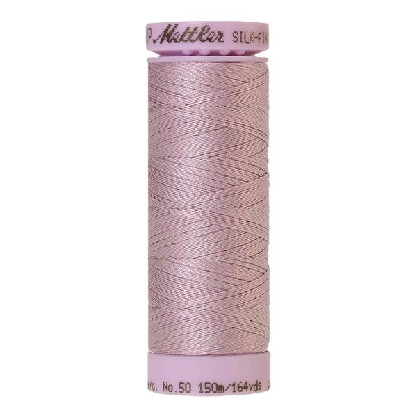 Spool of greyish mauve cotton thread - code 0035