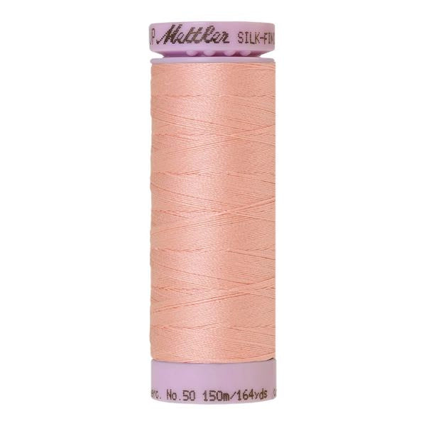 Spool of Mettler Silk Finished Cotton Thread in colour Iced Pink 0075