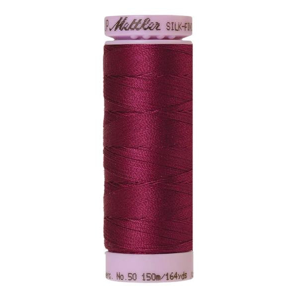 Spool of burgundy cotton thread - code 0157