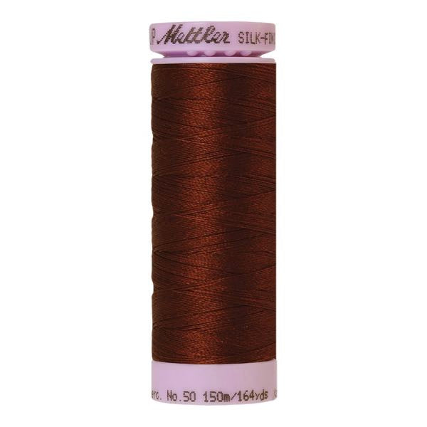 Spool of reddy brown coloured cotton thread - Friar Brown code 0173