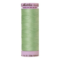 A spool of meadow green cotton thread - code 0220