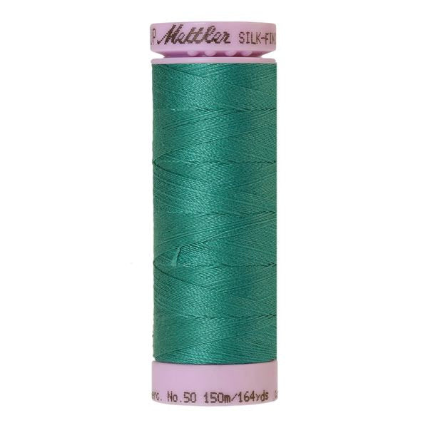 Spool of green coloured cotton thread - code 0222