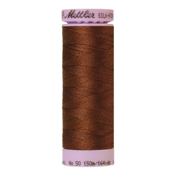 Spool of reddy brown coloured cotton thread - Redwood code 0263