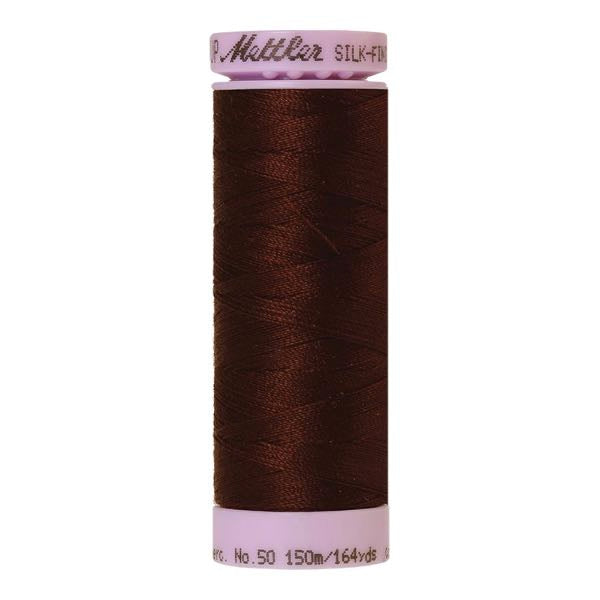 Spool of reddy brown coloured cotton thread - Andorra 0264