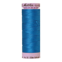Spool of bright blue coloured cotton thread - Mediterranean Blue code 0339