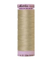 Spool of beige coloured cotton thread - Tantone code 0372