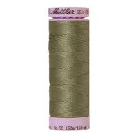 Spool of green coloured cotton thread - Sage code 0381