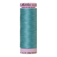 Spool of blue-green coloured cotton thread - Blue Green Opal code 0611