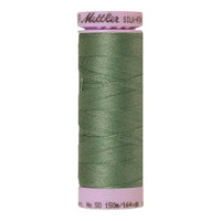 A spool of palm leaf green cotton thread - code 0646