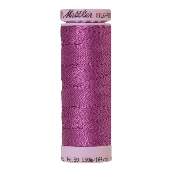 Spool of mauve cotton thread - code 1061