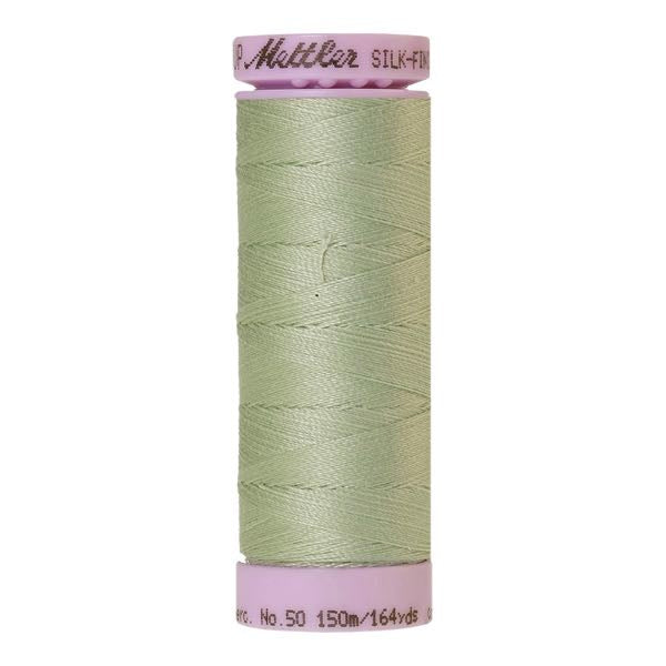 A spool of spanish moss green cotton thread - code 1095