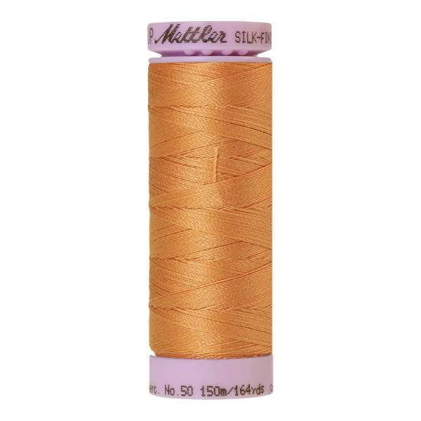 Spool of apricot coloured cotton thread - Dried Apricot code 1172